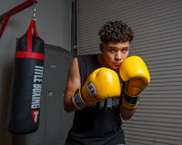variant:Yellow::Pro Mex Professional Bag Gloves V3.0 boy in boxing stance