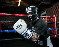 variant:white::Pro Mex Professional Training Gloves 3.0 guy posing infront of ring
