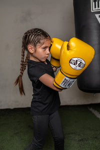 variant:yellow::Pro Mex Professional Training Gloves 3.0 little girl hitting bag