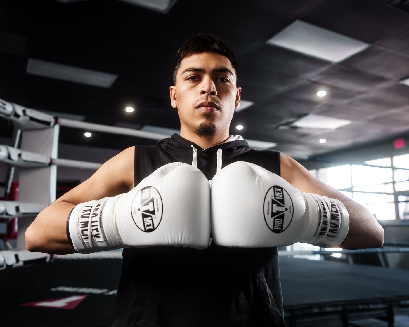 variant:white/black::Pro Mex Professional Lace Sparring Gloves V3.0 guy standing hands together 