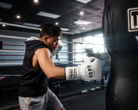 variant:white/black::Pro Mex Professional Lace Sparring Gloves V3.0 kid kitting bag right jab