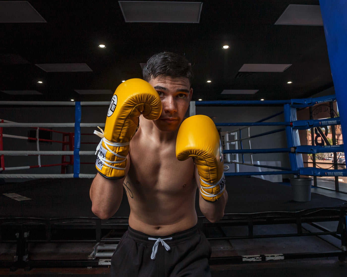 variant:Yellow/Black::Pro Mex Professional Lace Sparring Gloves V3.0 guy boxing pose