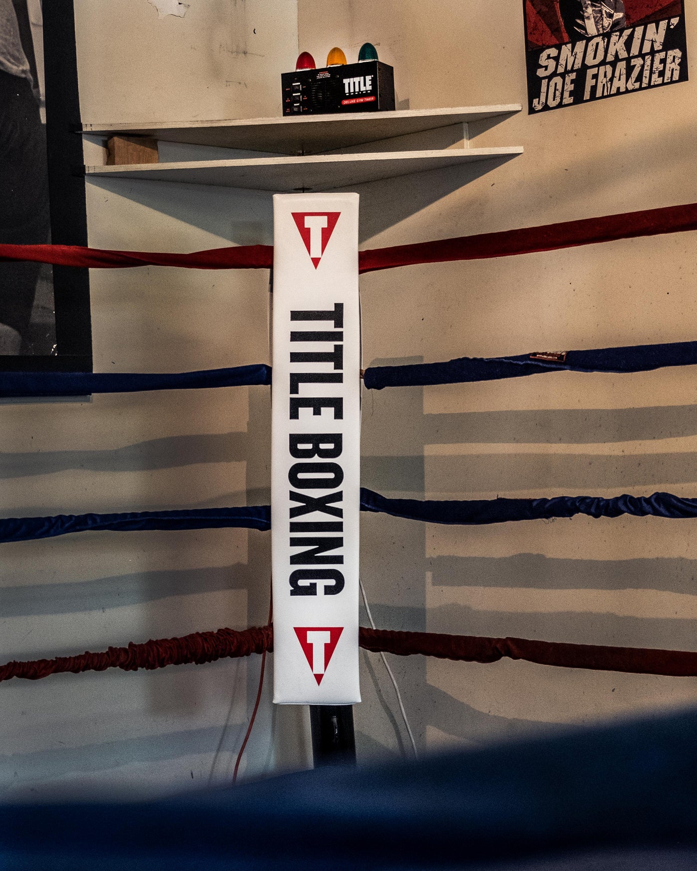 variant:red/white/blue::TITLE Boxing Pro Corner Cushions V3P – Set Of 4 image showing white corner cushion in boxing ring