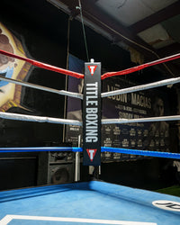 variant:black::TITLE Boxing Pro Corner Cushions V3P – Set Of 4 image showing corner cushion in boxing ring