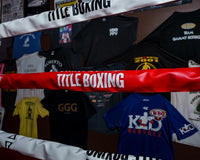 variant:red::TITLE Boxing Pro Vinyl Zippered Rope Cover 4.0 image showing rope cover on boxing ring
