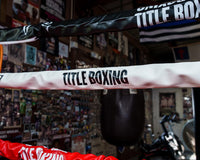variant:white::TITLE Boxing Pro Vinyl Zippered Rope Cover 4.0 image showing rope cover on boxing ring