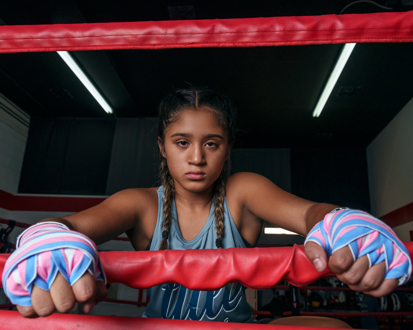 variant:blue/white::TITLE Boxing Select 180" Semi Elastic Mexican Hand Wraps girl on ring ropes