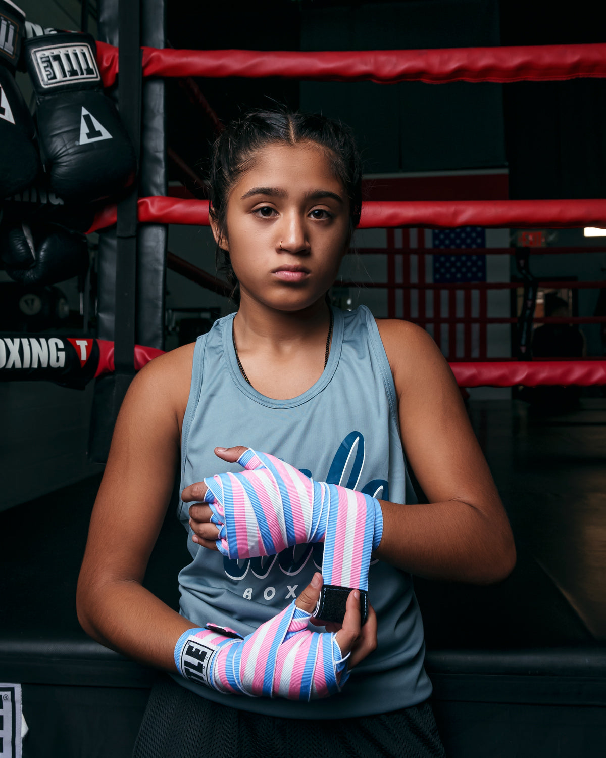 variant:blue/white::TITLE Boxing Select 180" Semi Elastic Mexican Hand Wraps girl putting on wraps