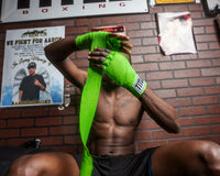 variant::neon lime::TITLE Boxing Select 180" Semi Elastic Mexican Hand Wraps guy putting on wraps