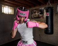 variant:neon pink::TITLE Boxing Select 180" Semi Elastic Mexican Hand Wraps boxer in all pink headgear
