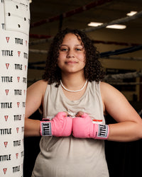 variant:neon pink::TITLE Boxing Select 180" Semi Elastic Mexican Hand Wraps hands together