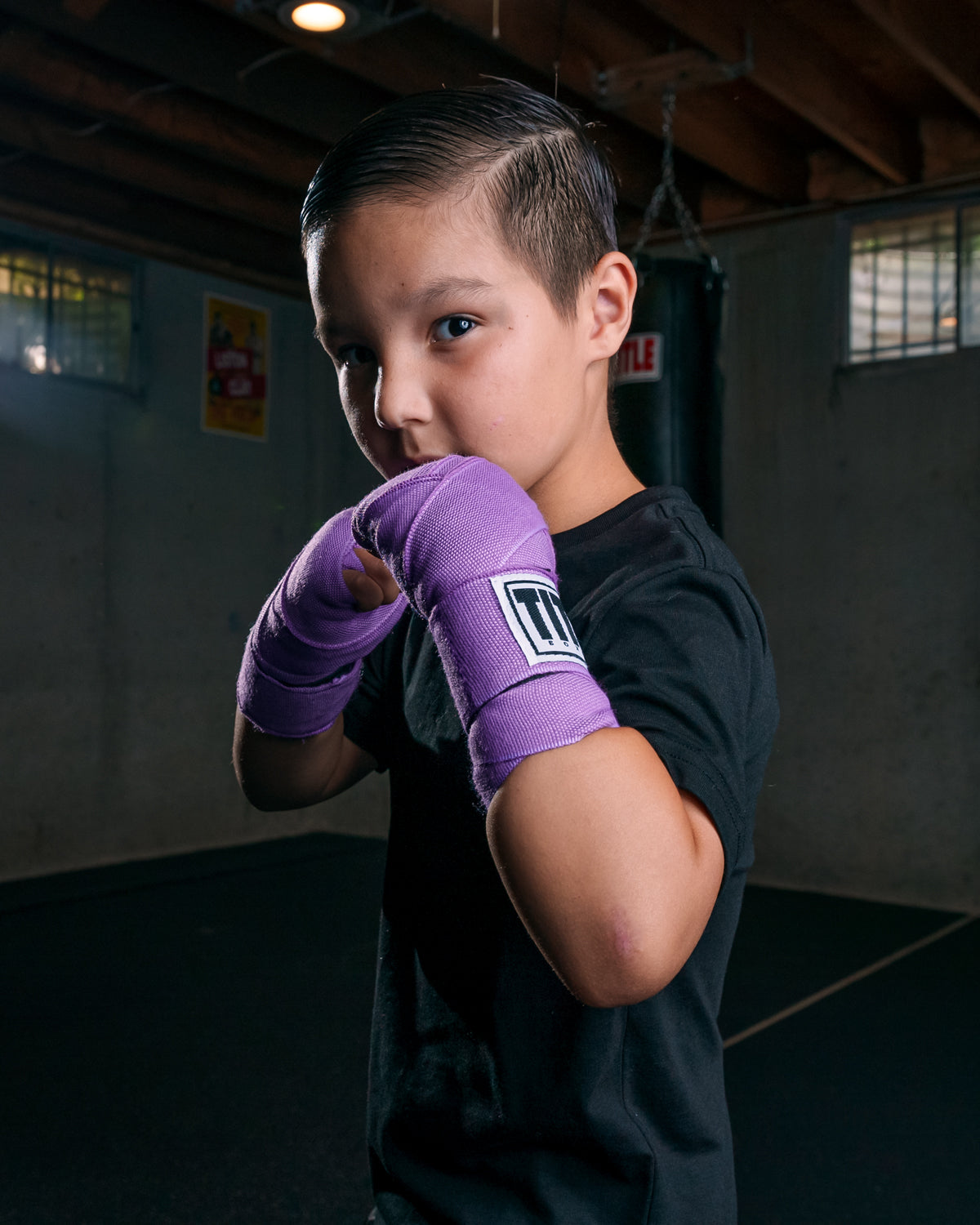 variant:light purple::TITLE Boxing Select 180" Semi Elastic Mexican Hand Wraps kid boxing pose