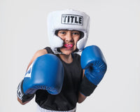variant:pink::TITLE Boxing Super Shield X2 Mouth Guard in a young boxer's mouth