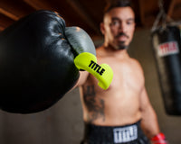 variant:yellow::TITLE Boxing Super Shield X2 Mouth Guard guy holding mouth guard