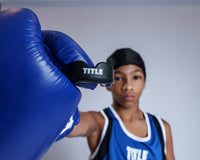 variant:black::TITLE Boxing Super Shield X2 Mouth Guard guy holding mouthguard