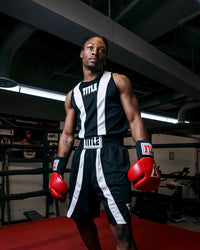 variant:black/white::TITLE Boxing Momentum Amateur Boxing Set guy standing in ring