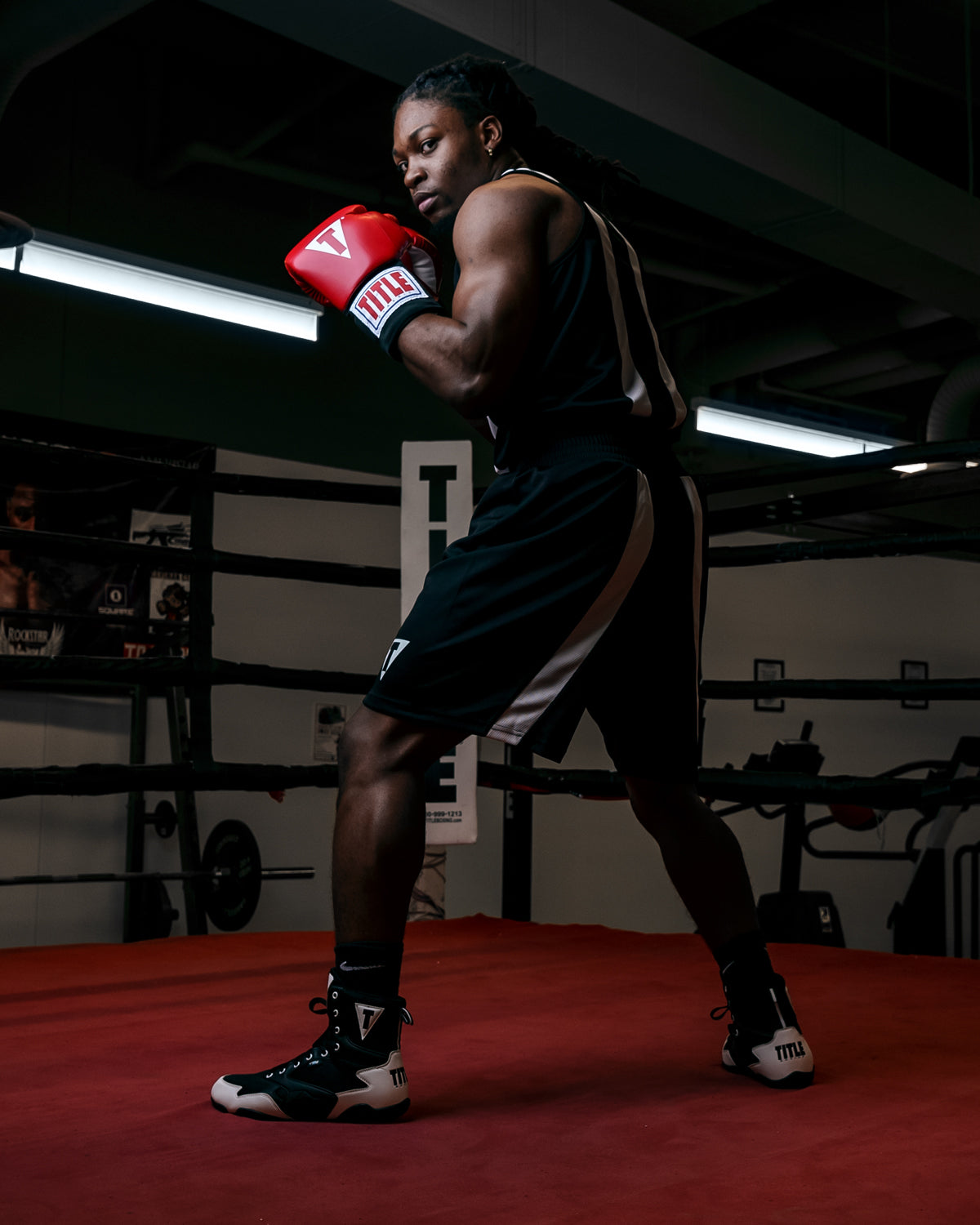 variant:black/white::TITLE Boxing Momentum Amateur Boxing Set guy in ring looking back