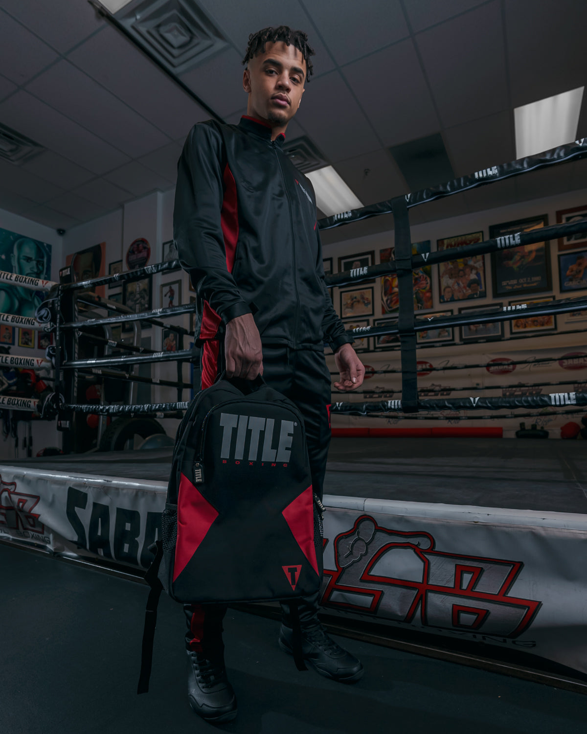 variant:black/Red::TITLE Boxing Competitor Backpack guy carrying down low