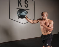 variant:12 lbs::TITLE Boxing Rubber Medicine Ball guy throwing ball