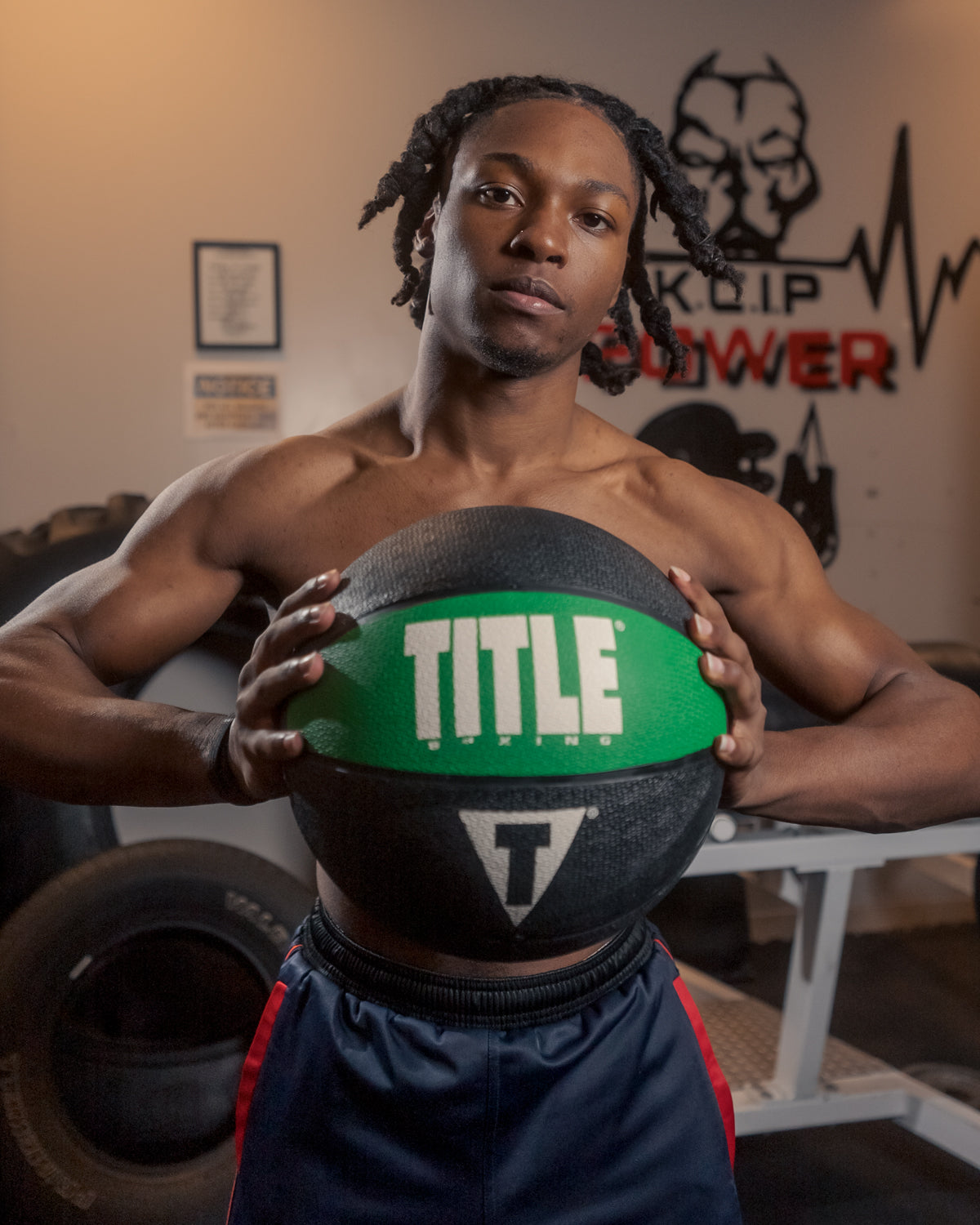variant:15 lbs::TITLE Boxing Rubber Medicine Ball guy holding ball in hands