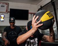 variant:10 lbs::TITLE Boxing Rubber Medicine Ball guy throwing over head