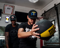 variant:10 lbs::TITLE Boxing Rubber Medicine Ball guy holding out infront of him