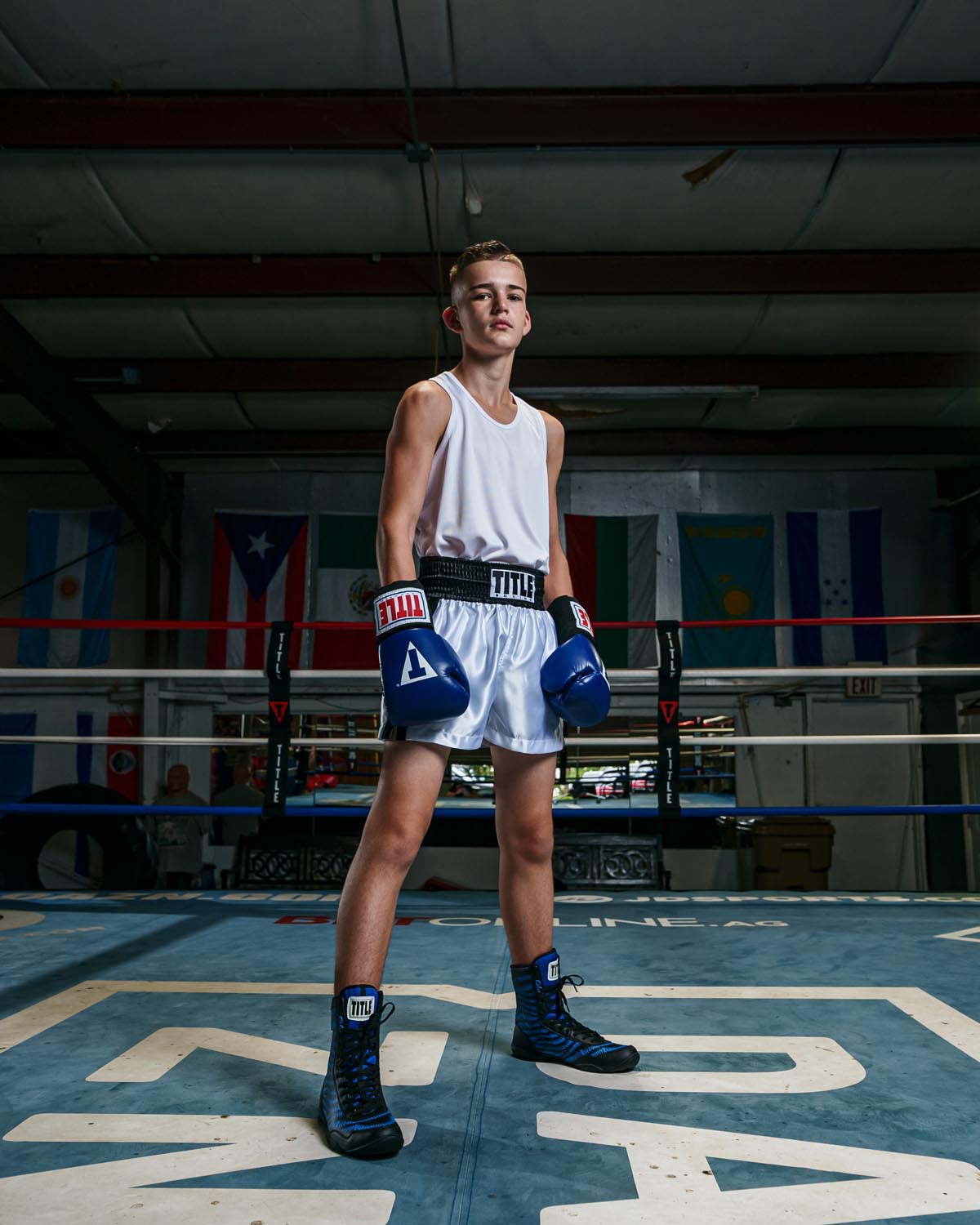 variant:white::TITLE Boxing Aerovent Elite Racerback Boxing Jersey 2.0 kid in ring