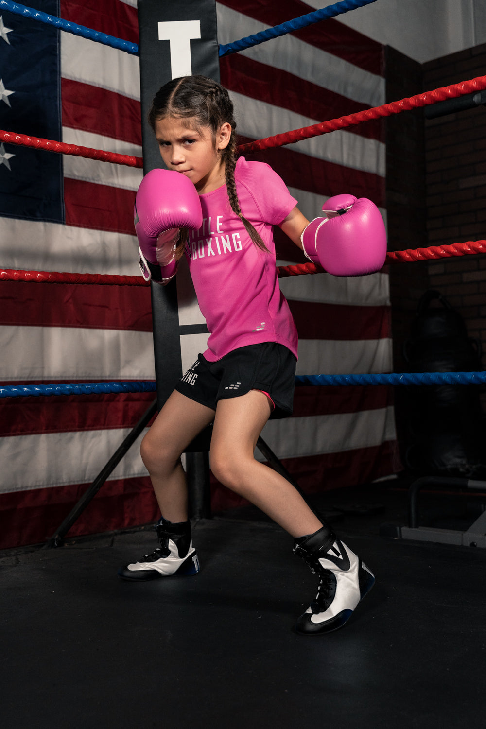 variant:Black/White::TITLE Boxing Speed-Flex Encore Mid-Top Shoes girl posing in shoes