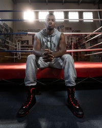 variant:Black/Red::TITLE Boxing Total Balance Shoes man sitting in ring