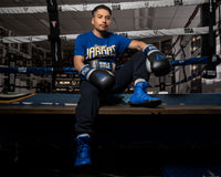 variant:Blue/Black::TITLE Boxing Total Balance Shoes man sitting in ring posing