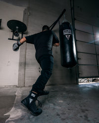 variant:black/grey::TITLE Predator II Boxing Shoes guy hitting bag