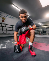variant:black/red::TITLE Predator II Boxing Shoes kid kneeling