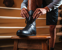 variant:black::TITLE Boxing High-Top Leather Boxing Shoes main view put on shoe