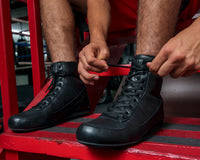 variant:lifestyle::TITLE Boxing Old School Leather Boxing Shoes man tying shoes