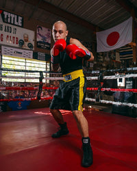 variant:black/gold::TITLE Boxing Edge Boxing Trunks 2.0 guy in ring club red gloves