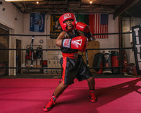 variant:black/red::TITLE Boxing Edge Boxing Trunks 2.0 little kid in ring right hook