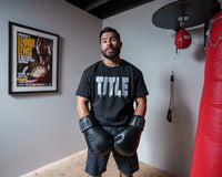 variant:Black/Grey::TITLE Boxing Iconic Block Tee man posing in tee
