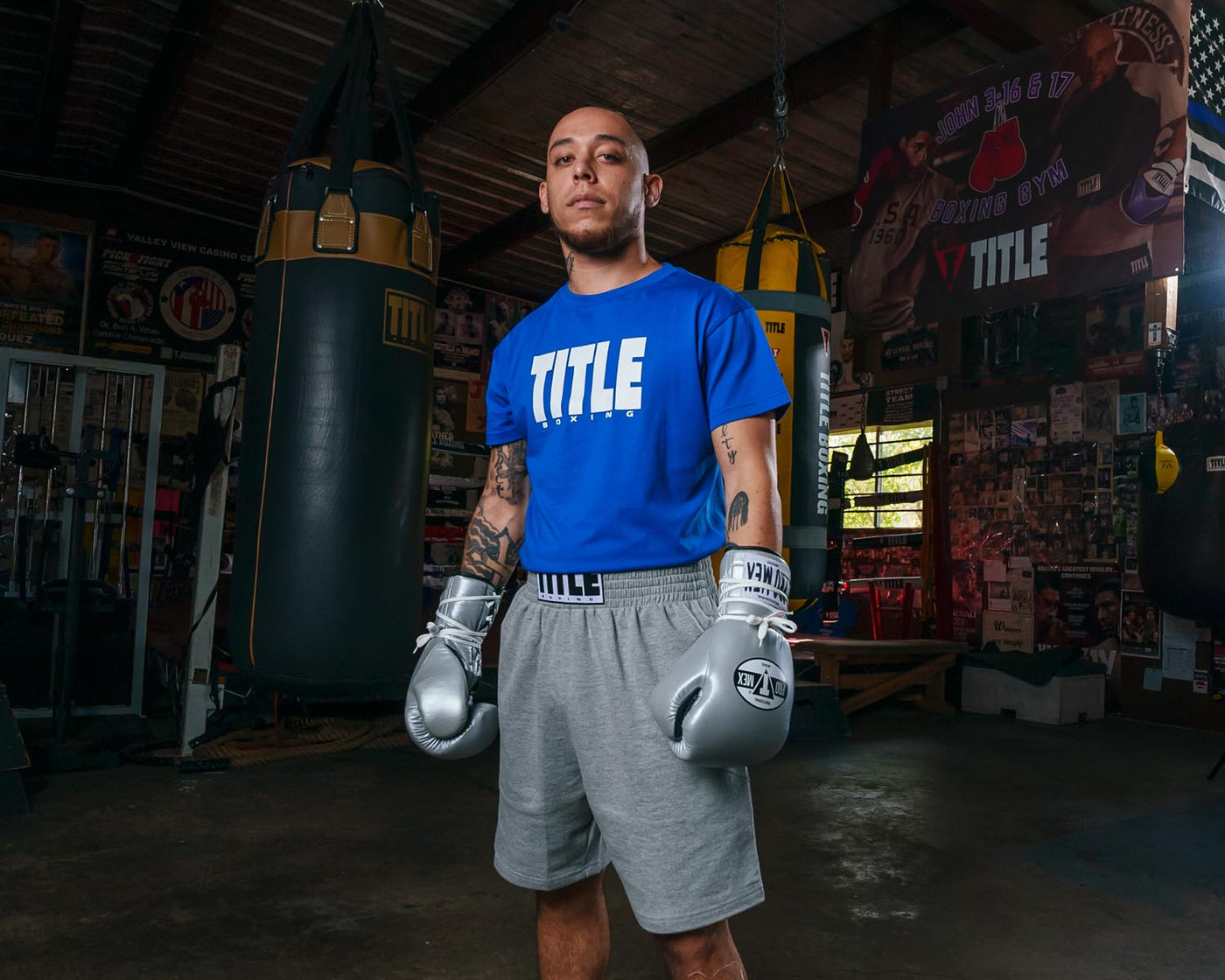 variant:Blue/White::TITLE Boxing Iconic Block Tee man posing in tee