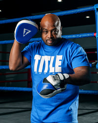 variant:Blue/White::TITLE Boxing Iconic Block Tee man posing in tee