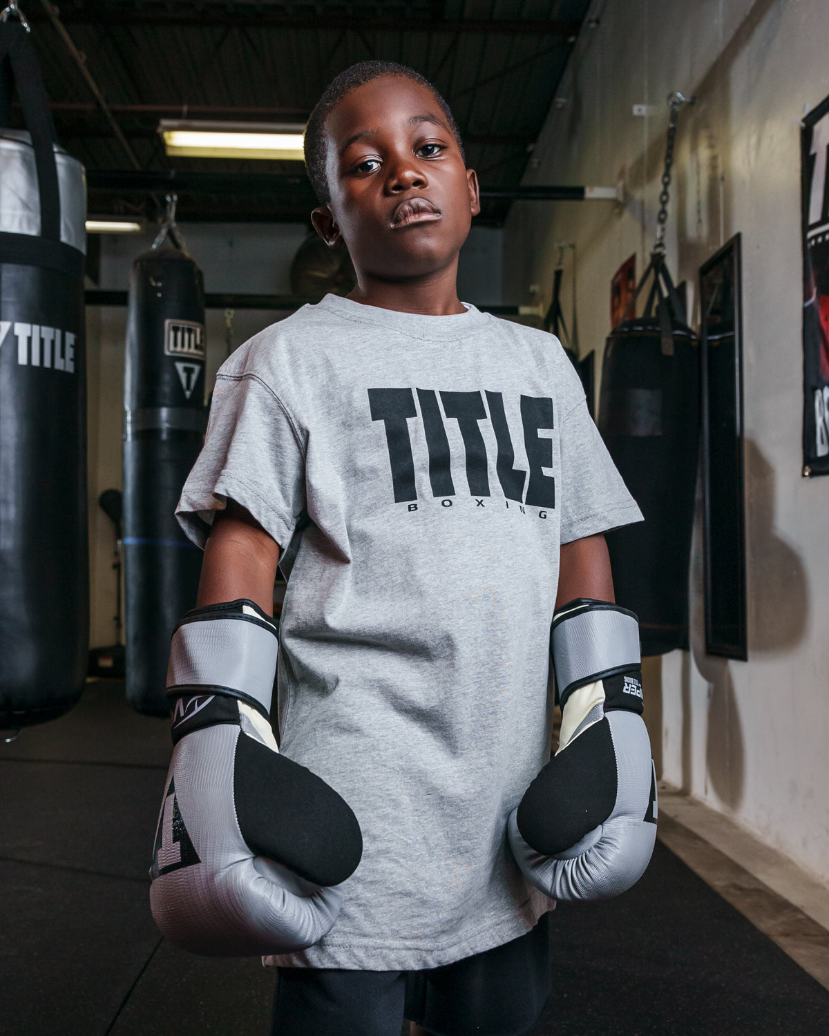 variant:Grey/Black::TITLE Boxing Iconic Block Tee kid posing in tee