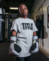 variant:Grey/Black::TITLE Boxing Iconic Block Tee kid posing in tee