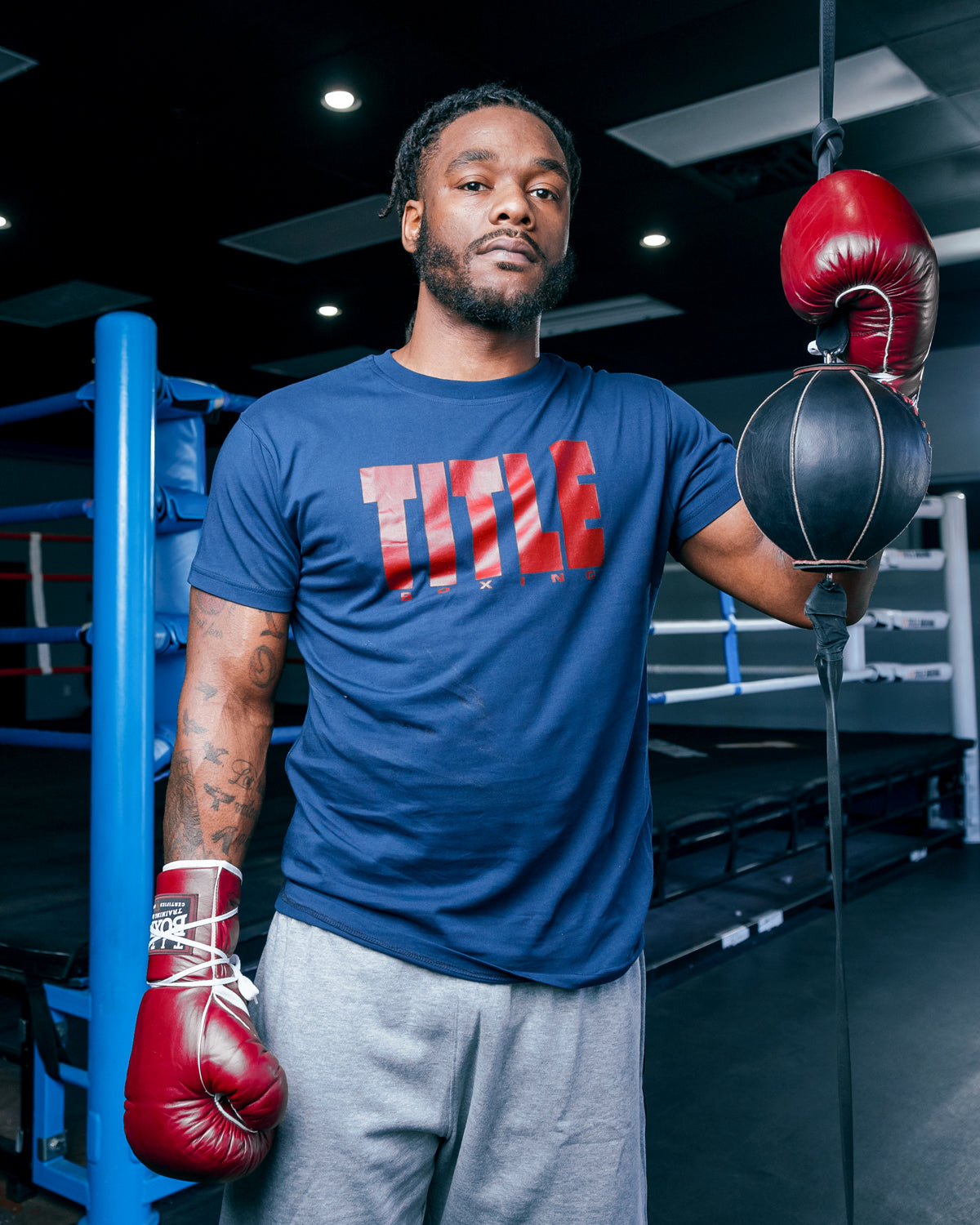 variant:Navy/Red::TITLE Boxing Iconic Block Tee man posing in tee