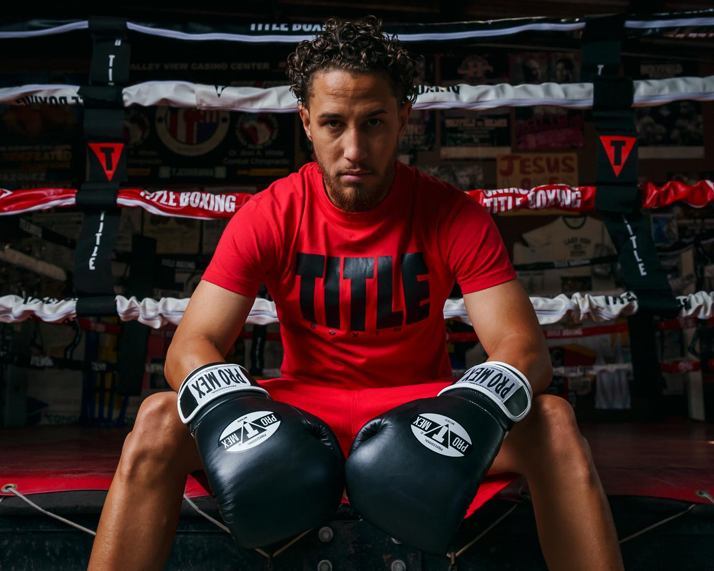 variant:Red/Black::TITLE Boxing Iconic Block Tee man posing in tee