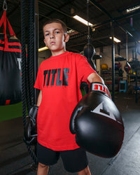 variant:Red/Black::TITLE Boxing Iconic Block Tee kid posing in tee