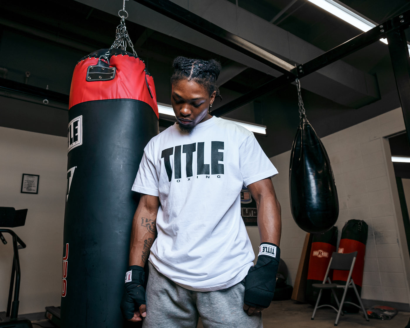 variant:White/Black::TITLE Boxing Iconic Block Tee man posing in tee
