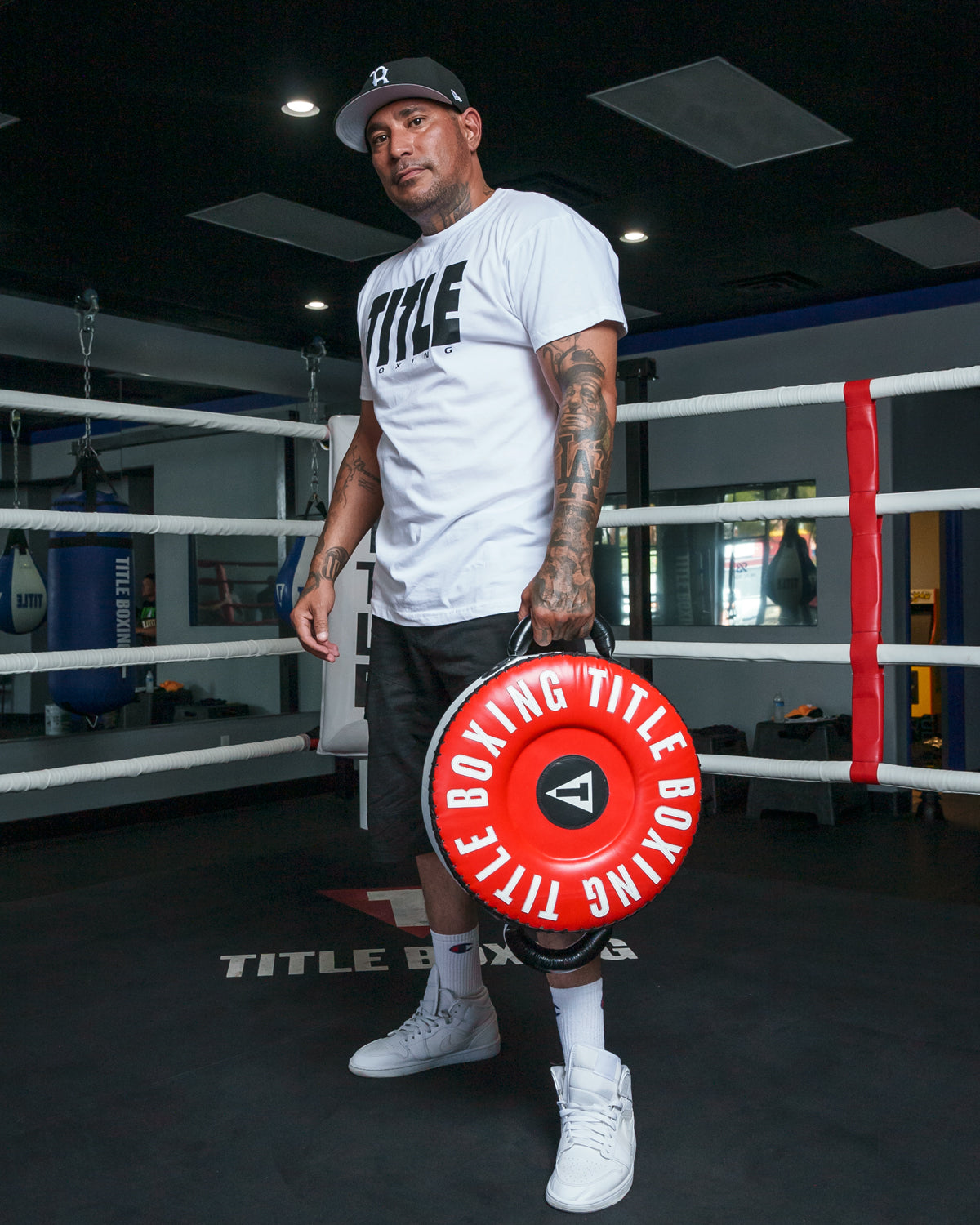 variant:White/Black::TITLE Boxing Iconic Block Tee man posing in tee