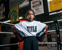 variant:White/Black::TITLE Boxing Iconic Block Tee girl posing in tee