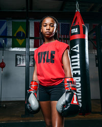 variant:Red/Black::TITLE Boxing Iconic Block Muscle Tee girl posing in tee