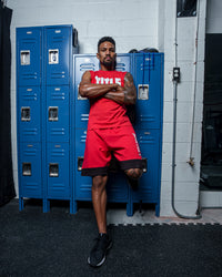 variant:Red/White::TITLE Boxing Iconic Block Muscle Tee man posing in tee