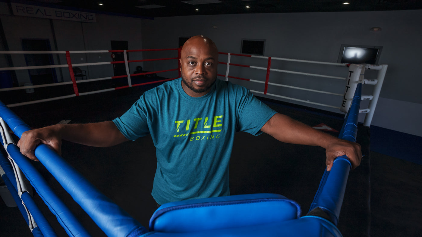 variant:Blue::TITLE Boxing Striped Wordmark Tee